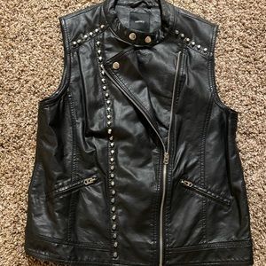 Faux leather vest with flat top cone studs